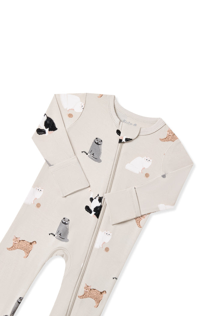 Close up of the zipper garage and fold over hand cuffs on the Zippered Romper in Fluffy Cat